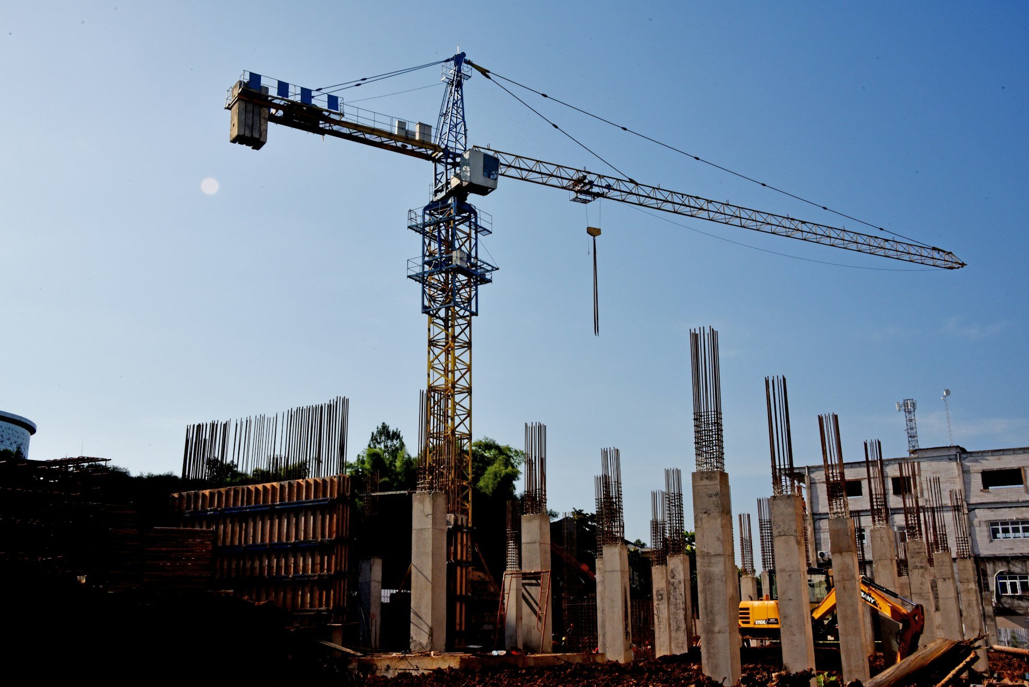 Construction site with structural concrete and cranes